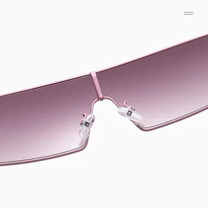 Close-up of pink gradient shield sunglasses with sleek metal frame and soft nose pads