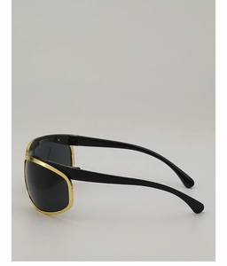 Side view of Y2K sunglasses featuring a gold wrap-around frame and black lenses