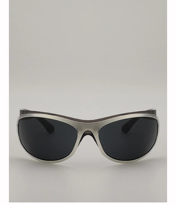 Close-up of Y2K wraparound sunglasses with silver metallic frames and dark oval lenses