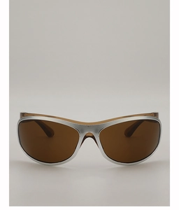 Close-up of curved silver metallic frame sunglasses with tinted brown wrap lenses