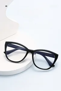 Macro shot of stylish black cat-eye glasses frame on a minimalist studio display stand