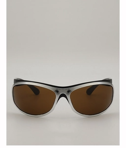 Close-up of retro futuristic silver sunglasses with dark brown lenses and sleek black temples