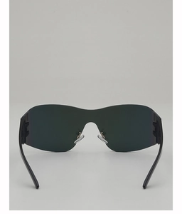 Detail of Y2K shield sunglasses featuring black lenses and silver-tone nose pads