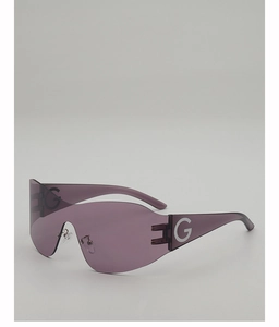 Detail of pink transparent Y2K wrap-around sunglasses with white letter G on the side