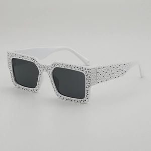 Retro rectangular sunglasses with sparkling rhinestones on white frame and dark lenses