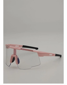 Detail view of pink cycling glasses with wide transparent lens and anti-slip nose pads