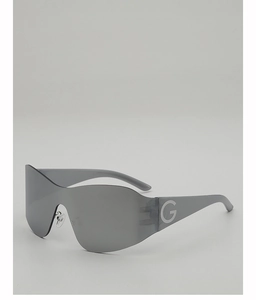 Close-up of Y2K wraparound sunglasses featuring silver mirror lenses and a G-logo detail
