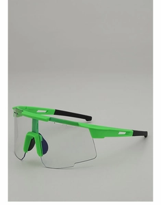 Detail of green semi-rimless cycling sunglasses with aerodynamic transparent lens