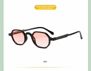 Detail view of vintage hexagonal kids sunglasses with black frame and gradient tea pink lens