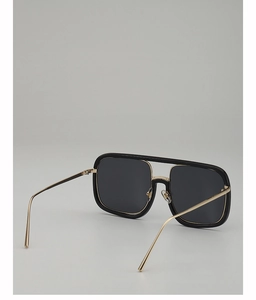 Detail of square double-bridge sunglasses with black frame and gold metal temples