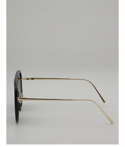 Side view of square sunglasses with black frame and slim gold metal temples