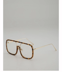 Detailed view of tortoiseshell square frame glasses with slim gold metal temples