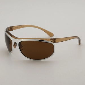Y2K curved oversized sunglasses with silver metal front and translucent brown temples