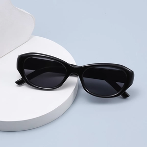 Classic black oval cat-eye sunglasses with thick glossy frames and dark grey lenses