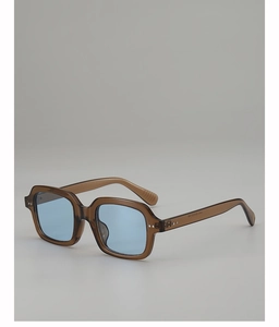 Detailed side view of leopard-pattern sunglasses featuring blue lenses and silver rivets