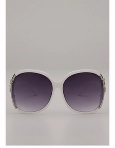 Detail of white oversized sunglasses with purple gradient lenses and silver flower carving