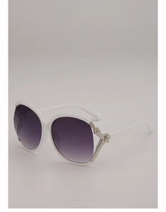 Detail of white oversized butterfly sunglasses with silver floral hinge and purple gradient lens
