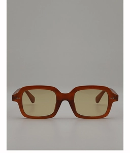 Macro detail of amber brown thick frame sunglasses with yellow lenses and silver rivets