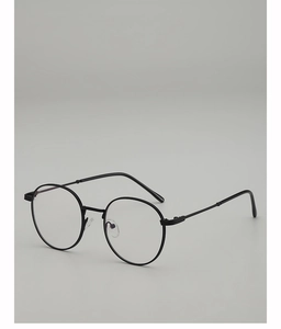 Close-up of minimalist black round metal frames with adjustable silicone nose pads