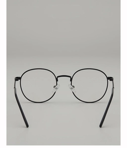 Detail of retro round metal eyeglass frames with nose pads and slim black temples