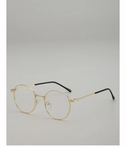 Close-up of retro round gold metal glasses frame with black anti-slip temple tips