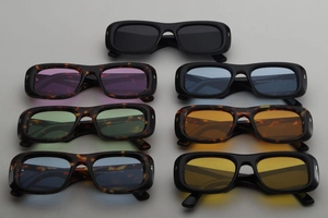 Detail view of square sunglasses frames in various colors including black and leopard print