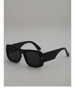 Detailed side view of square black sunglasses with silver diamond-shaped metal accents