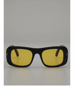Detail of square black frame sunglasses with yellow lenses and silver metal rivets