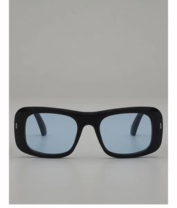 Detail of square black frame sunglasses with light blue lenses and silver metal rivets