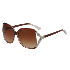 Oversized gradient brown sunglasses for women featuring floral metal accents on the temples