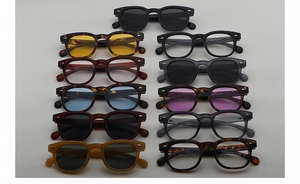 Flat lay of retro round sunglasses and frames in diverse colors with rivet details