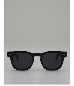 Detail of black round sunglasses with stylish silver diamond rivets on the frame corners
