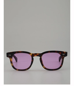 Close-up of retro tortoiseshell frames with purple lenses and silver rivet details