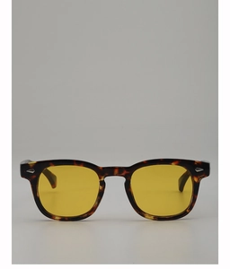 Detail of tortoiseshell frame with yellow lenses and silver arrow metal studs