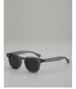 Close-up of temple engraving showing 3838 48-23-145 size on translucent gray sunglasses