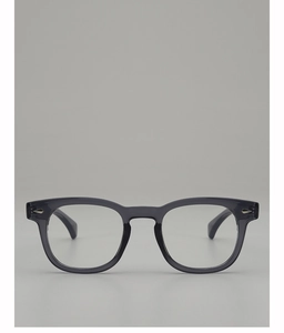 Detail of gray translucent retro round sunglasses with silver arrow rivets on the side