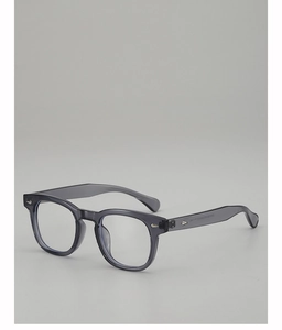 Detail of grey transparent Wellington frame glasses with silver diamond rivets on the side