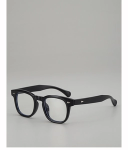Detail of high-gloss black round frames with silver diamond-shaped metal accents