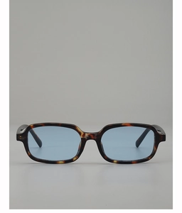 Detail of retro small square sunglasses featuring tortoise frame and light blue lenses