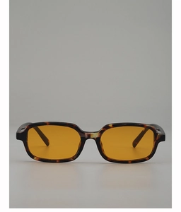 Detailed view of tortoiseshell rectangular sunglasses with vintage orange lenses