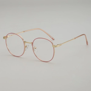 Retro round metal glasses frame in gold and pink finish shown from a 45-degree angle