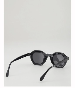 Detail of temple hinges and model 3941 printed on black hexagonal sunglasses