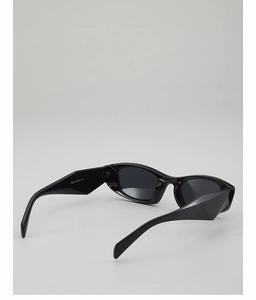 Detail view of thick geometric temples on black cat eye sunglasses with sharp cut lines