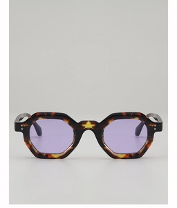 Close-up of tortoise shell geometric sunglasses with purple lenses and silver rivets