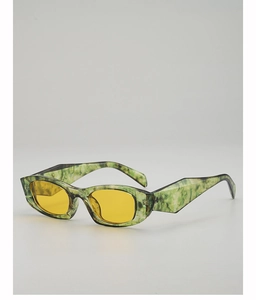 Close-up of green marble texture cat eye sunglasses with yellow lenses and wide legs