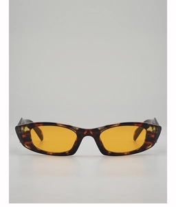Macro detail of dark tortoiseshell rectangular sunglasses with vibrant orange lenses