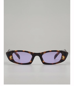 Detail of tortoise frame cat-eye sunglasses with purple lenses and wide temples