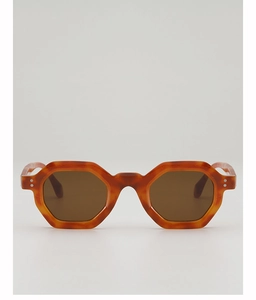 Close-up of stylish tortoiseshell geometric sunglasses with vintage metal rivets