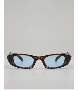 Close-up of tortoise shell cat eye sunglasses featuring vintage light blue tinted lenses