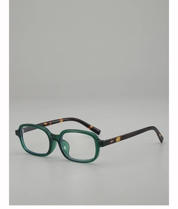 Detail view of square green translucent frame with vintage tortoiseshell temples
